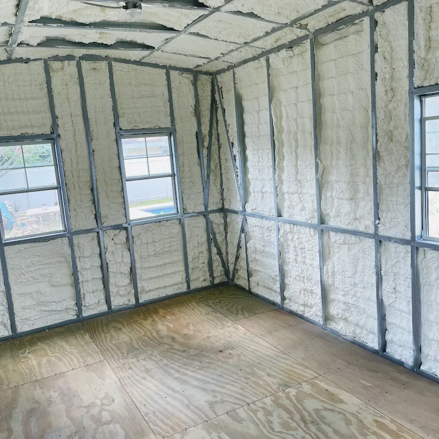 Closed-cell spray foam insulation applied to wall cavities in a residential project in Hayesville